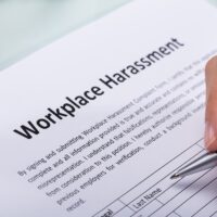 Woman Filling Workplace Harassment Form