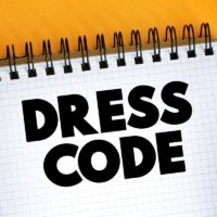 Dress Code text on notepad, concept background